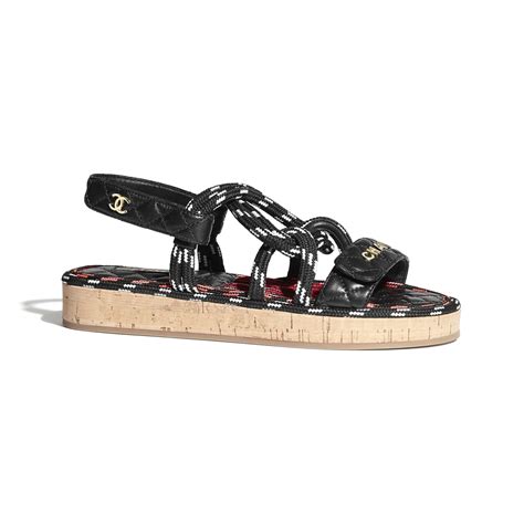 black and white chanel cord sandals.|Chanel kid sandals.